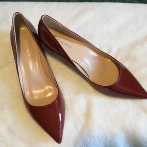 Brick red patent leather pumps